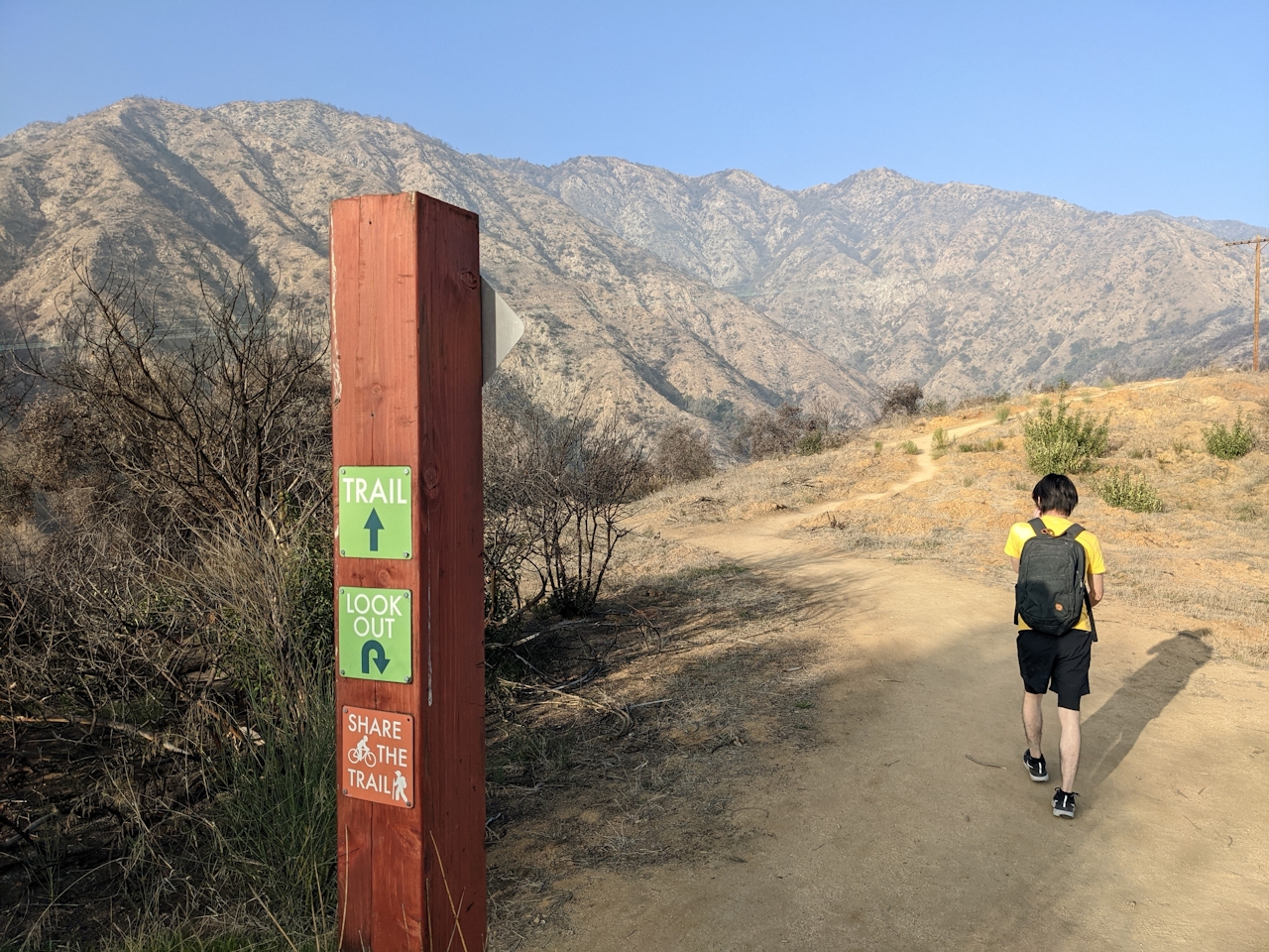 Hiker walking on a trail at Hillside Wilderness Preserve in Monrovia 