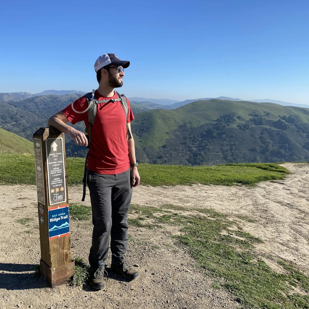 Person standing at the summit of Boccardo Loop Trail in Alum Park San Jose 