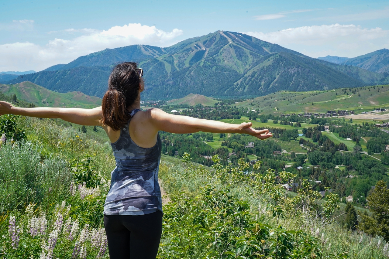 Person looking out to Bald Mountain from the Proctor Mountain Trail in Sun Valley Idaho 