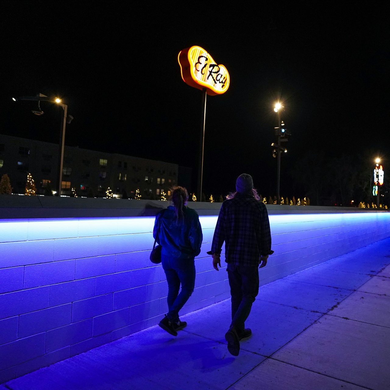 couple walking Neon Line in Reno