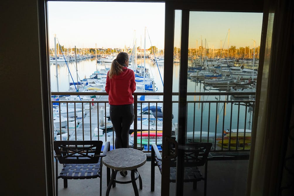 Woman on a balcony overlooking Channel Islands Harbor at Hampton Inn Channel Islands Harbor 