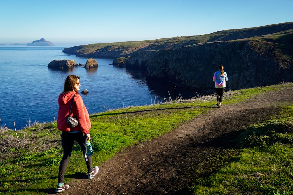 Two hikers on the Potato Harbora and Cavern Point hike at Channel Islands National Park Santa Cruz Island