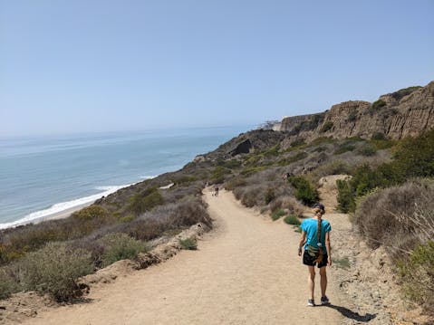 Woman hiking the San Onofre Bluffs Loop Trail to San Onofre State Beach in San Diego County 