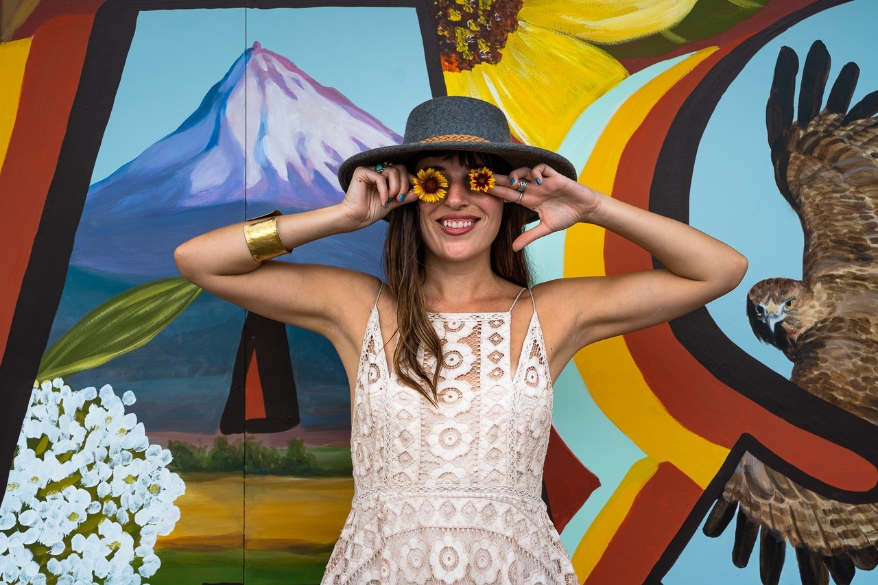 Woman in front of Oregon mural