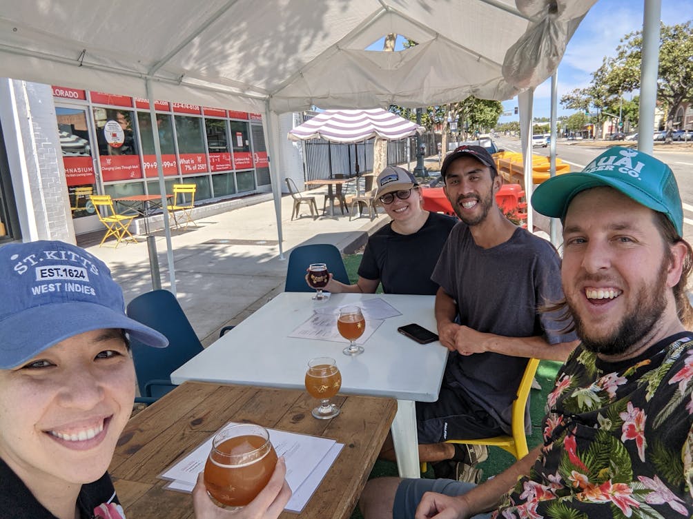 Group of friends enjoying beers and taking a selfie photo at Relentless Spirits in Eagle Rock Southern California 