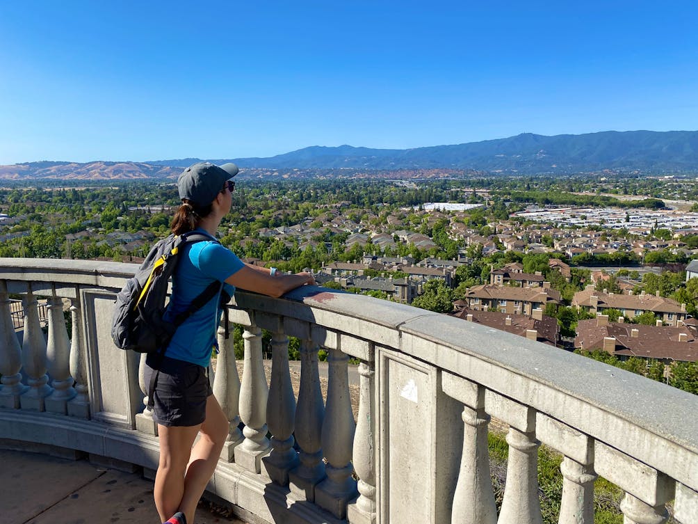 Hiker taking in the panoramic view of San Jose at the top of Communications Hill Grand Staircase 