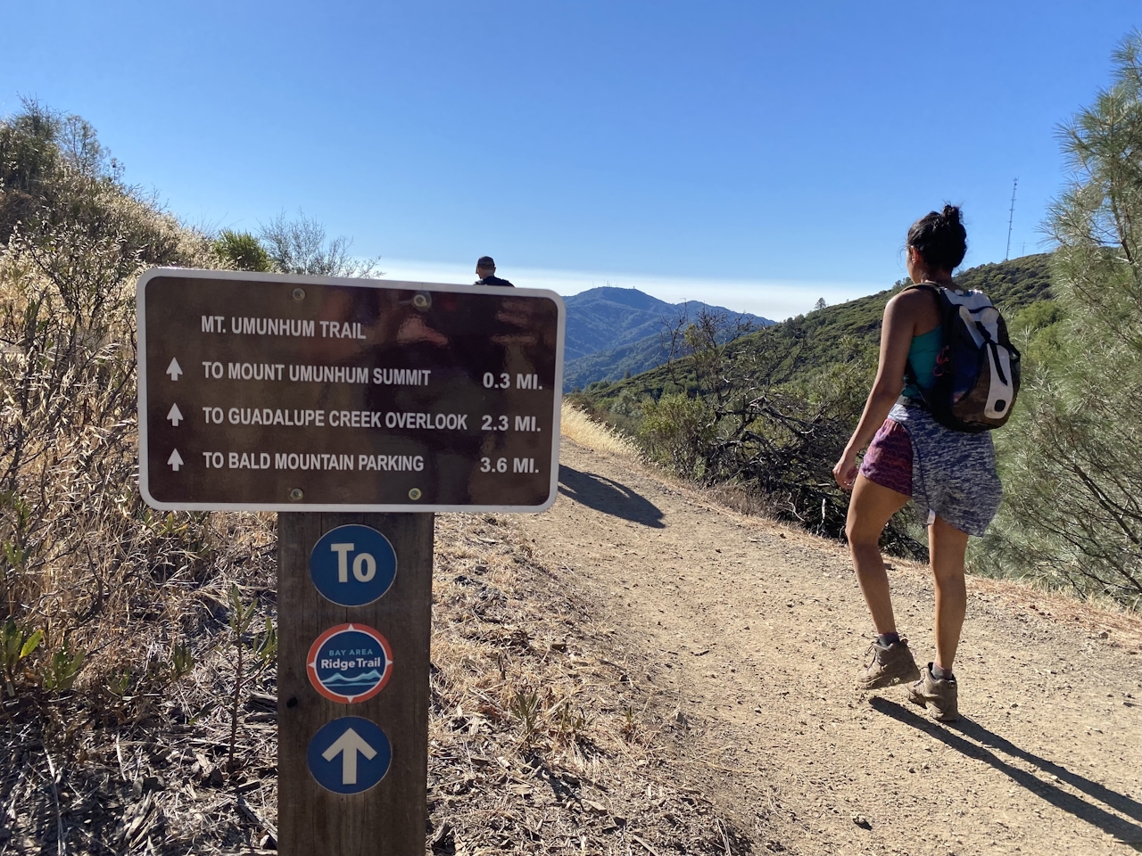 Hiker on the trail hiking up to the summit of Mount Umunhum in the South Bay 