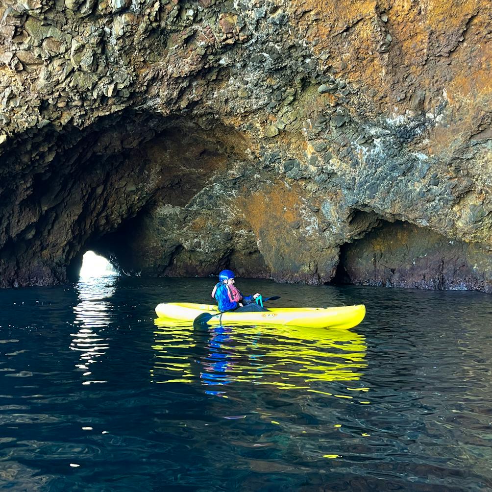 Kayaker outside a cave at Santa Cruz Island Channel Islands National Park
