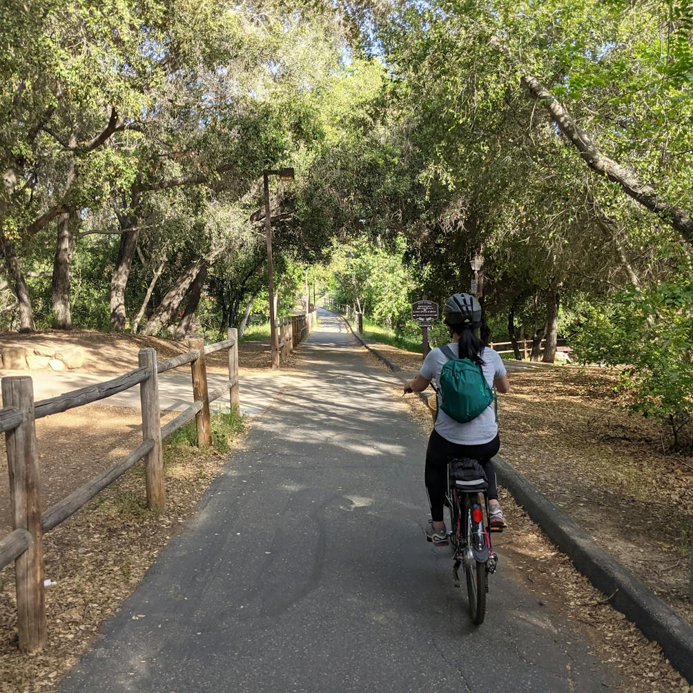 Woman riding her bike on the Ventura to Ojai bike path 