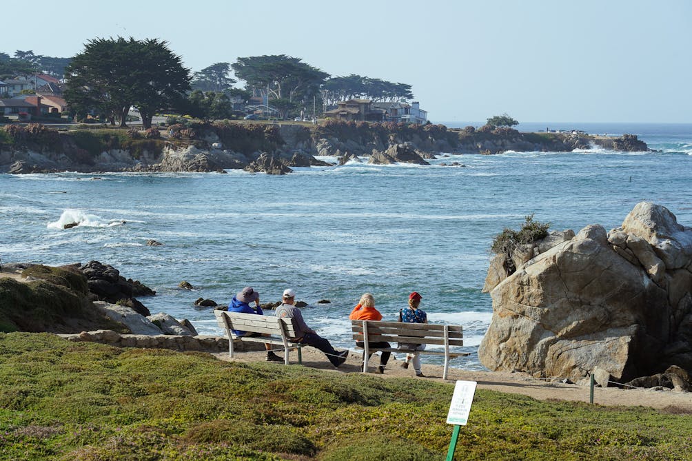 People sitting on bench Monterey Coastal Recreation Trail