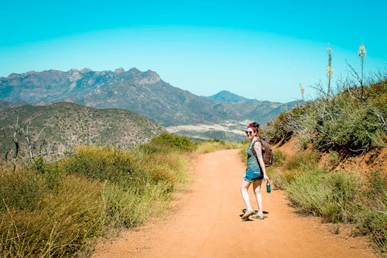 Woman hiking the Big Sycamore Canyon Loop Trail