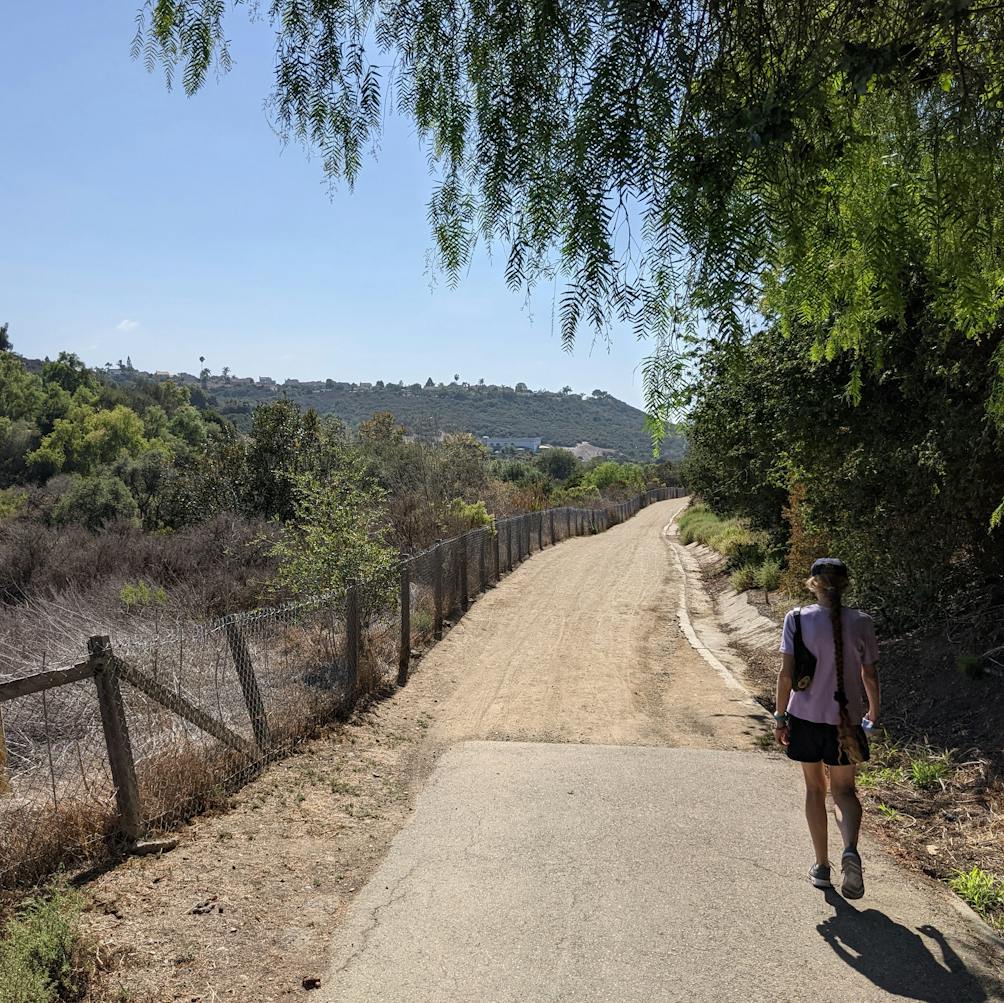 Woman on a wide open trail at Leo Carrillo Ranch Historic Park