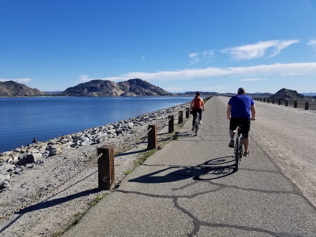 Bikers along the lakeside at Lake Perris State Recreational Area 