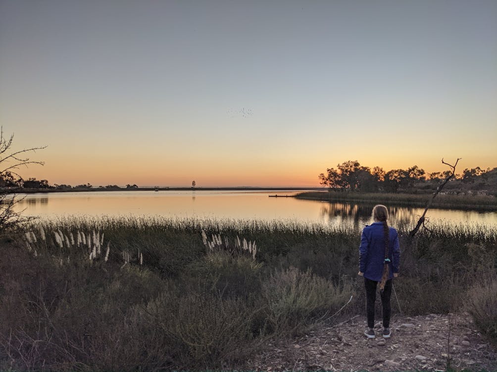 Woman at Lake Miramar Shoreline in San Diego 