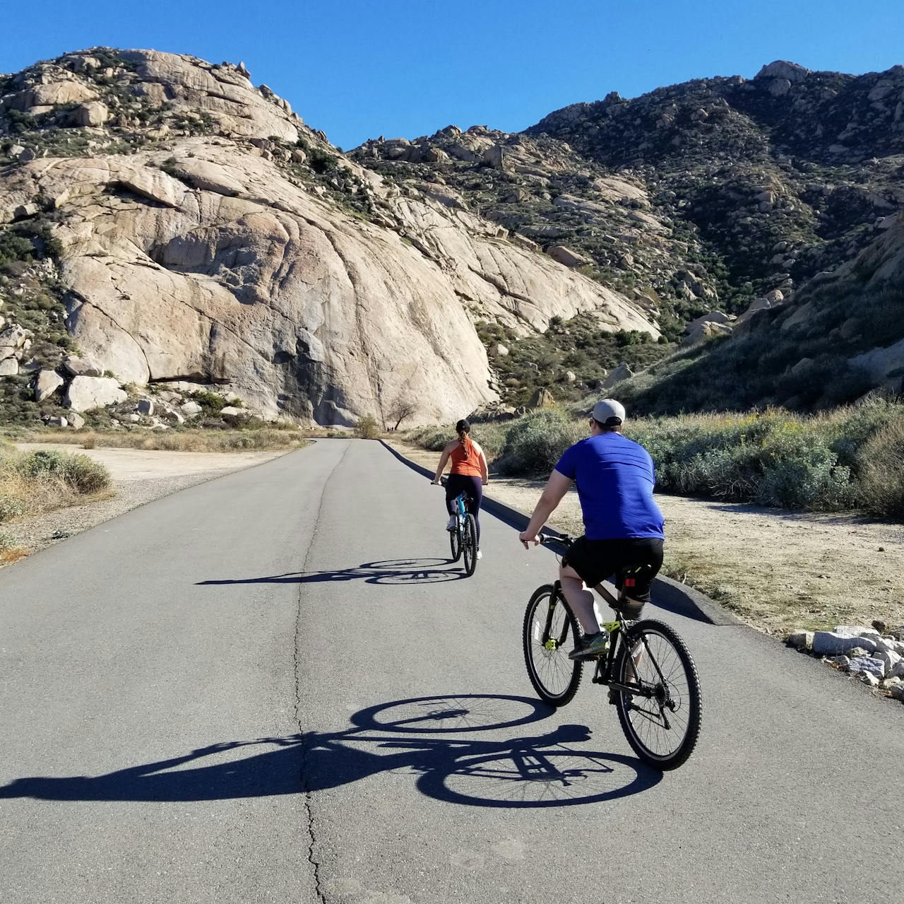 Two bike riders cycling at Lake Perris State Recreational Area 