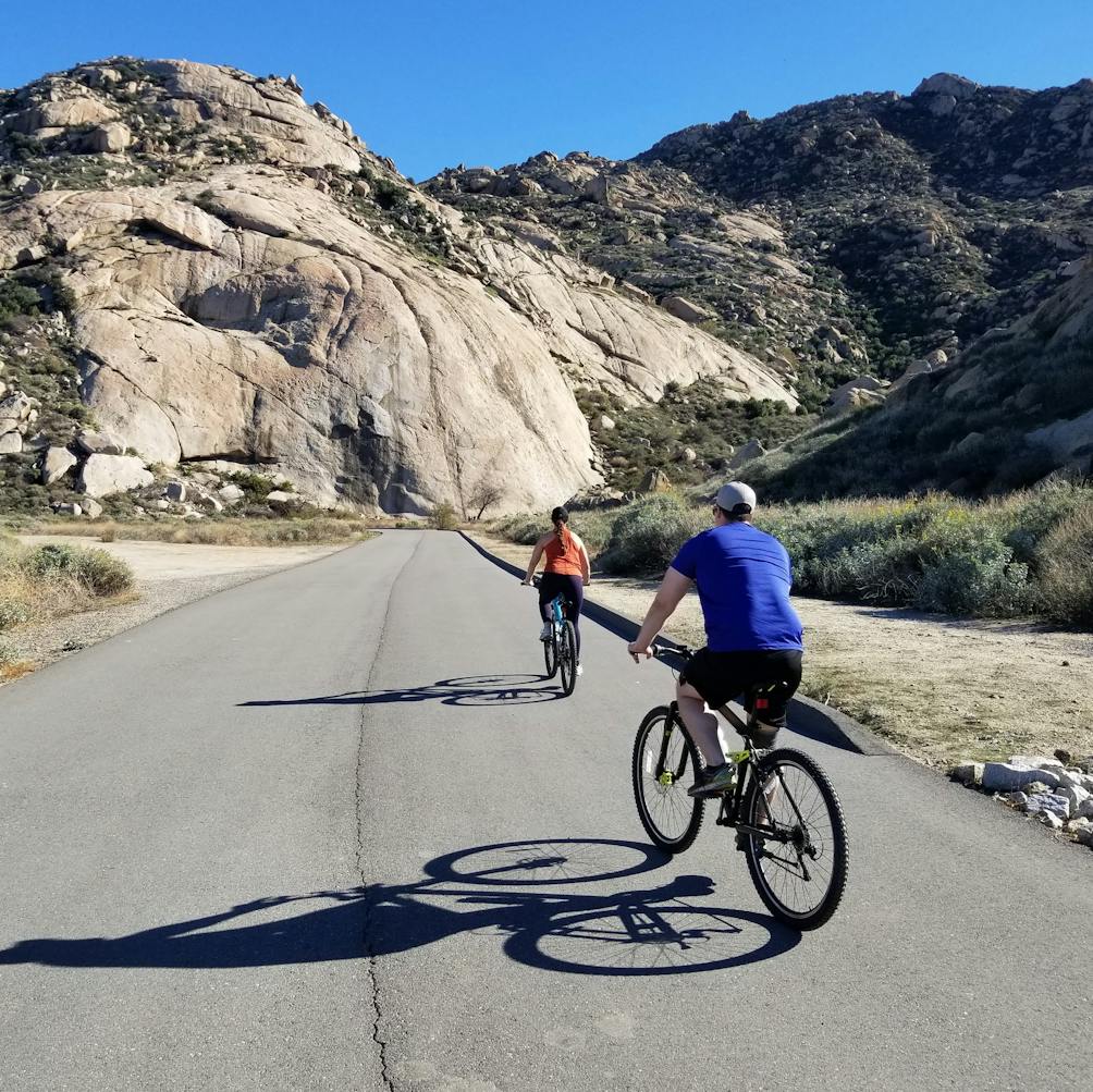 Two bike riders cycling at Lake Perris State Recreational Area 