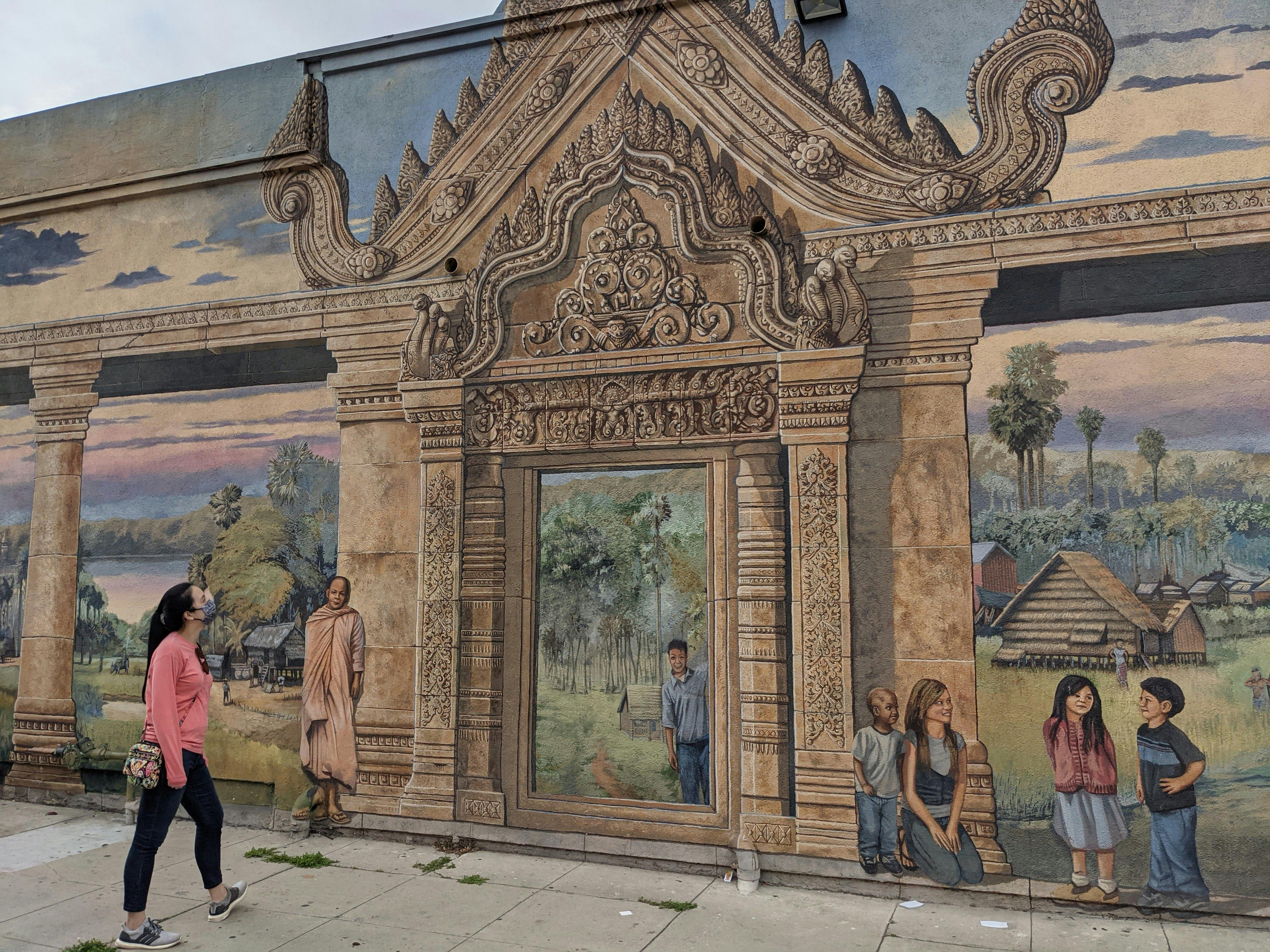 Woman looking at mural art in Long Beach