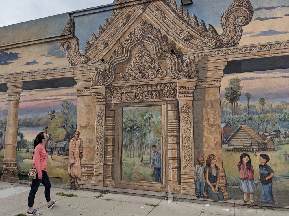 Woman looking at mural art in Long Beach