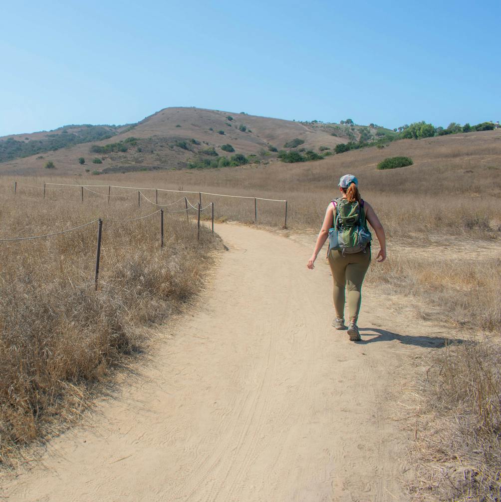 Hiker on open trail at Bommer Canyon Open Space Preserve in Orange County 