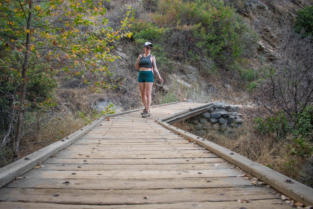 Woman hiking on a boardwalk at Big Dalton Canyon Wilderness Park in Los Angeles County 