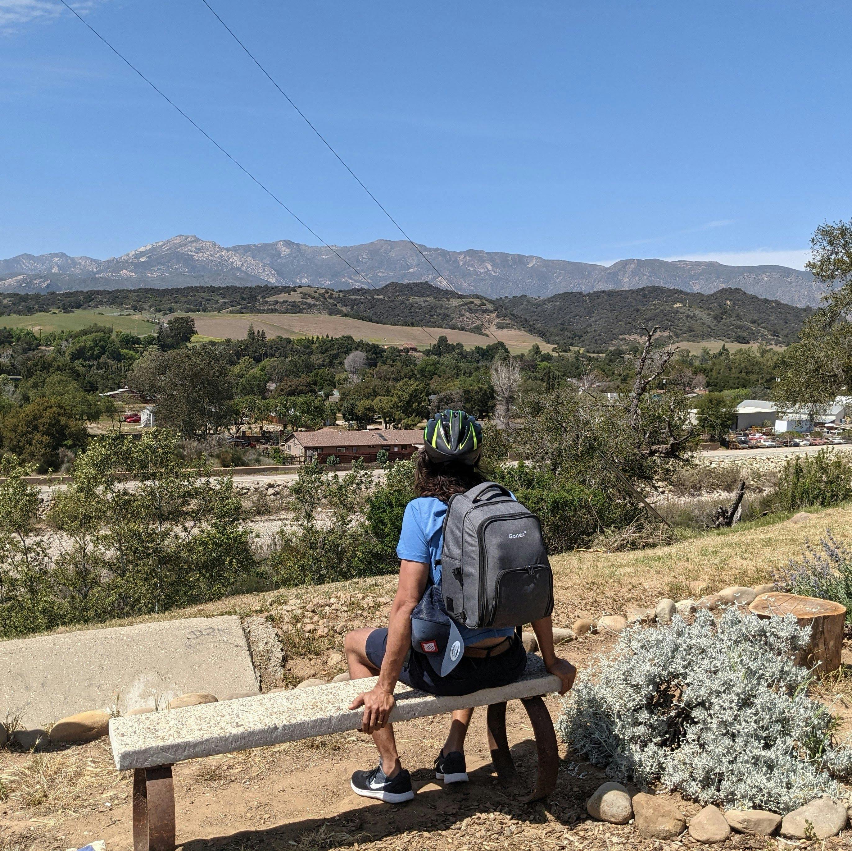 Man sitting on a bench overlooking the scenery on the Ventura to Ojai bike path