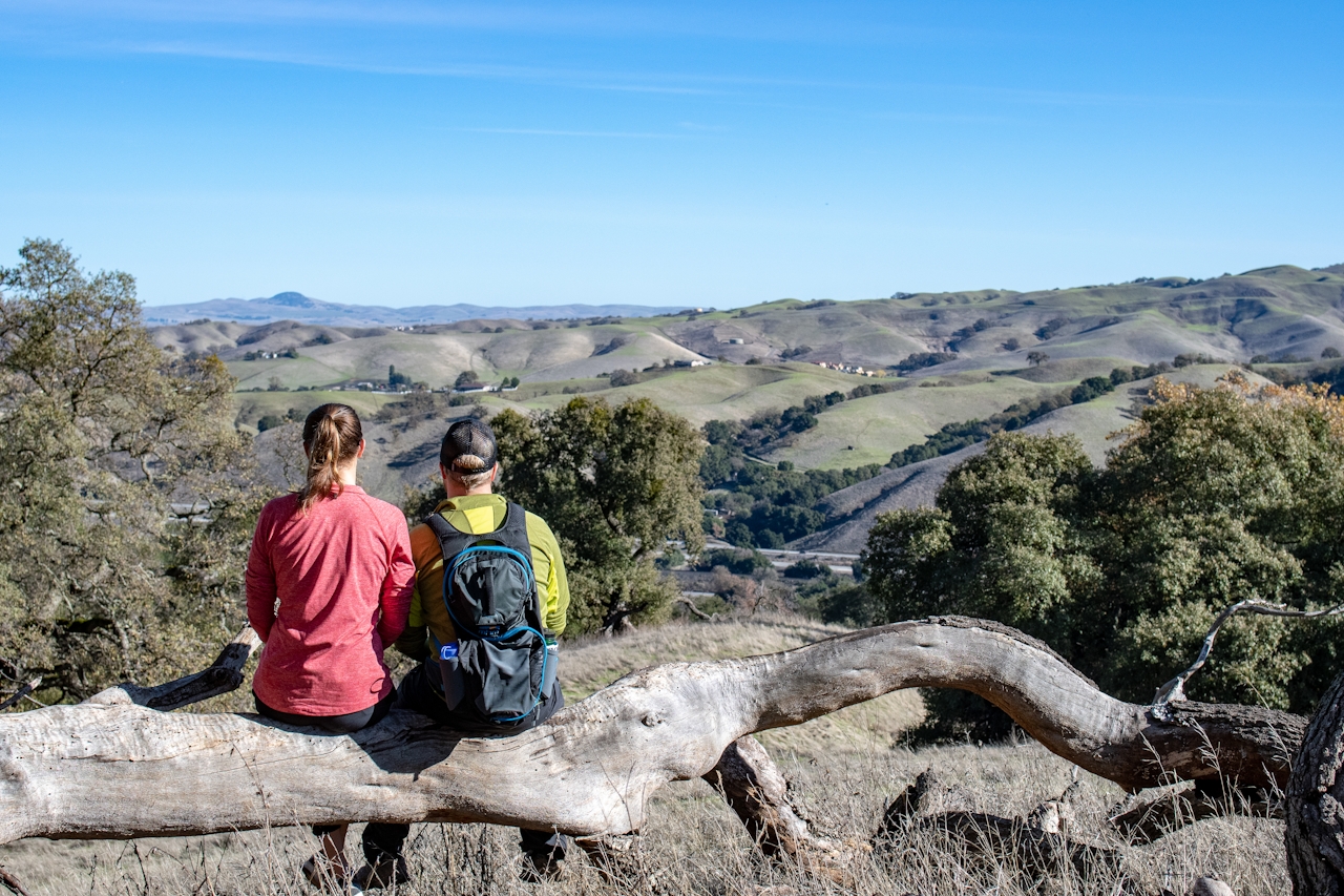 Woman hiking at Pleasanton Ridge Regional Park in the East Bay