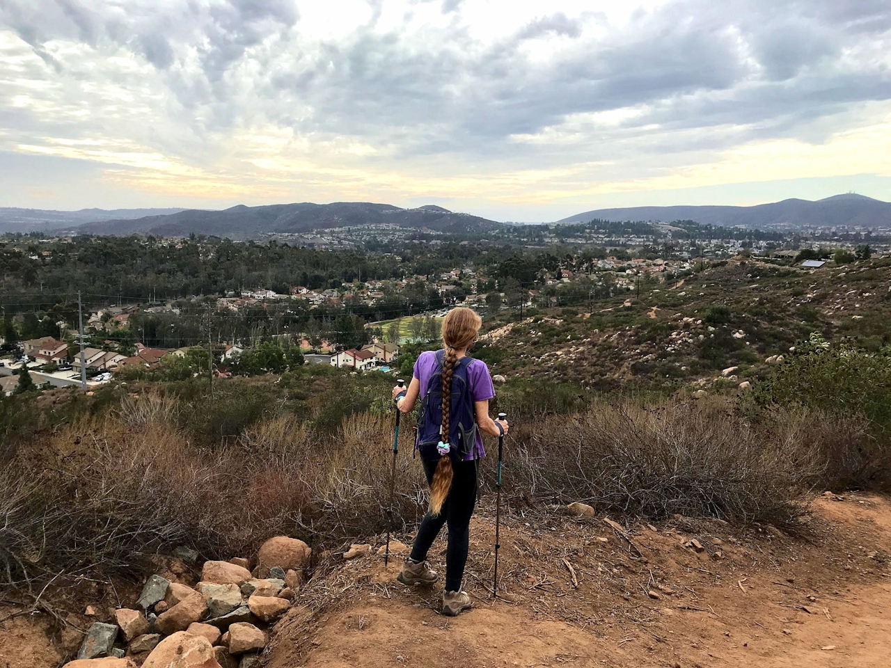 Woman on hiking trail to Twin Peaks in Poway San Diego County 