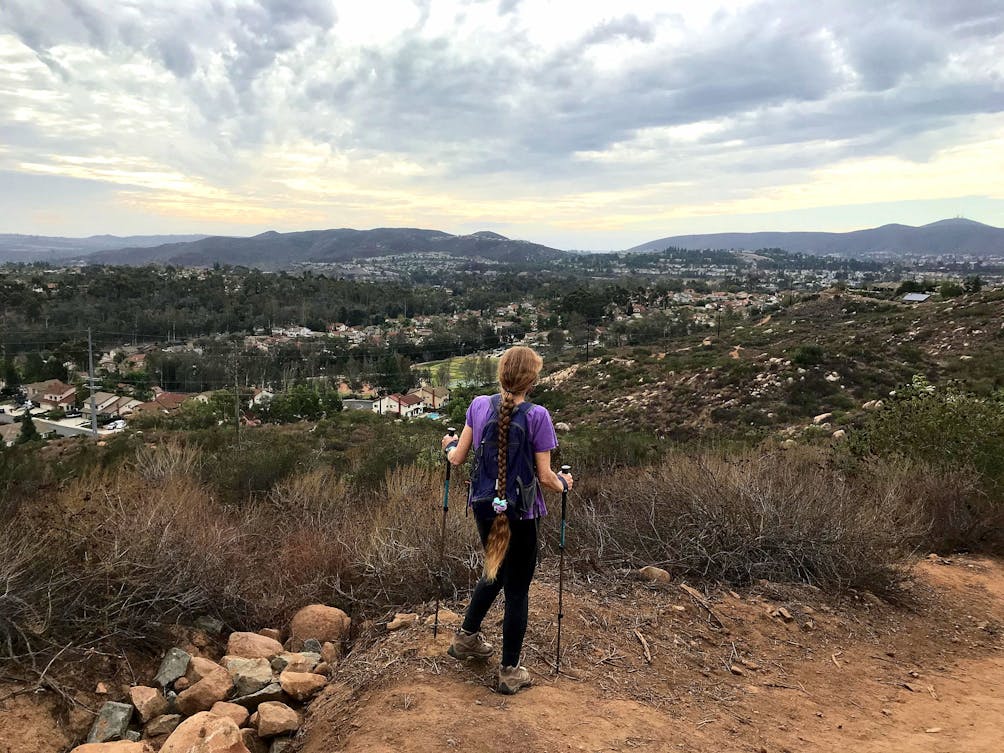 Woman on hiking trail to Twin Peaks in Poway San Diego County 