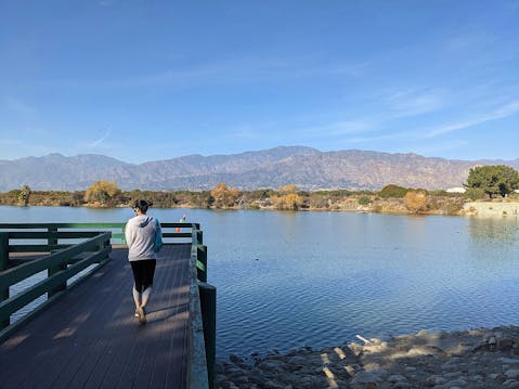 Woman on a boardwalk at Santa Fe Dam Recreation Area in Los Angeles County 