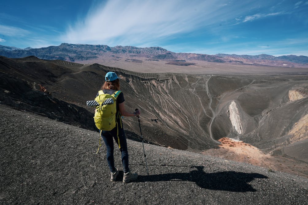 Woman hiking around Ubehebe Crater in Death Valley National Park 