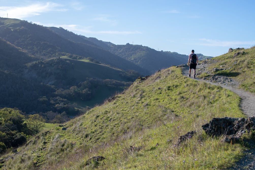 Hiker on trail at Sunol Wilderness Regional Preserve 