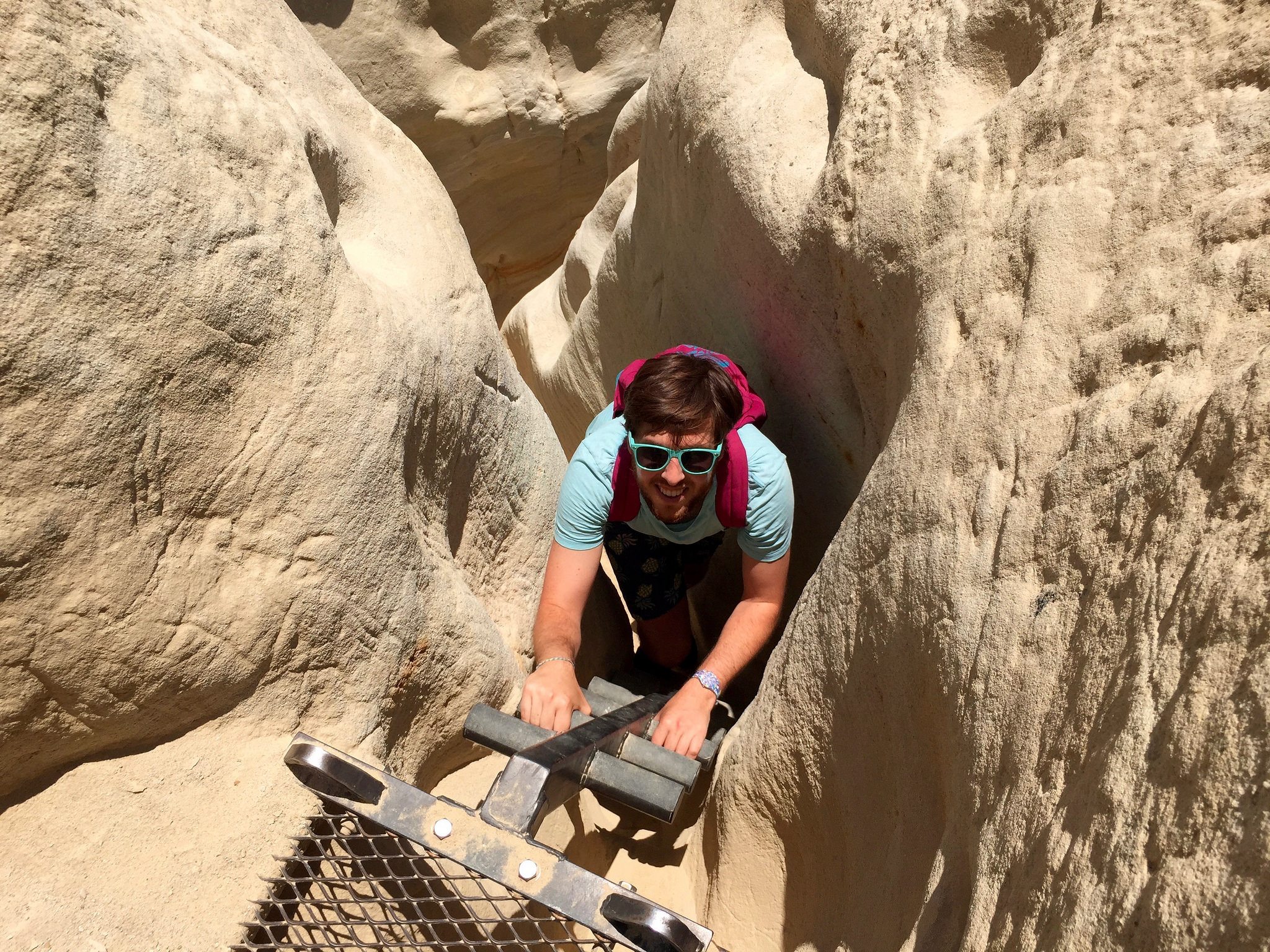 Weekend Sherpa writer Matt Pawlik descending into a slot canyon at Annie's Canyon in San Elijo Lagoon Ecological Reserve in Solana Beach 