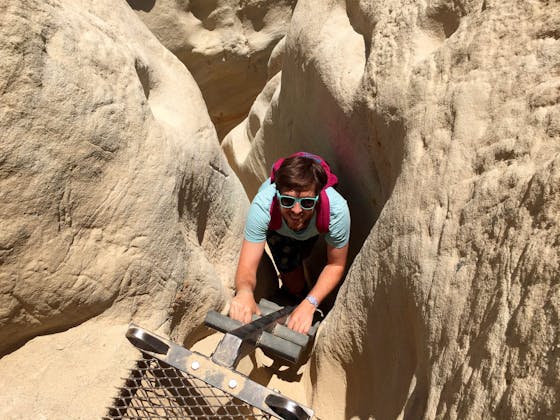 Weekend Sherpa writer Matt Pawlik descending into a slot canyon at Annie's Canyon in San Elijo Lagoon Ecological Reserve in Solana Beach 