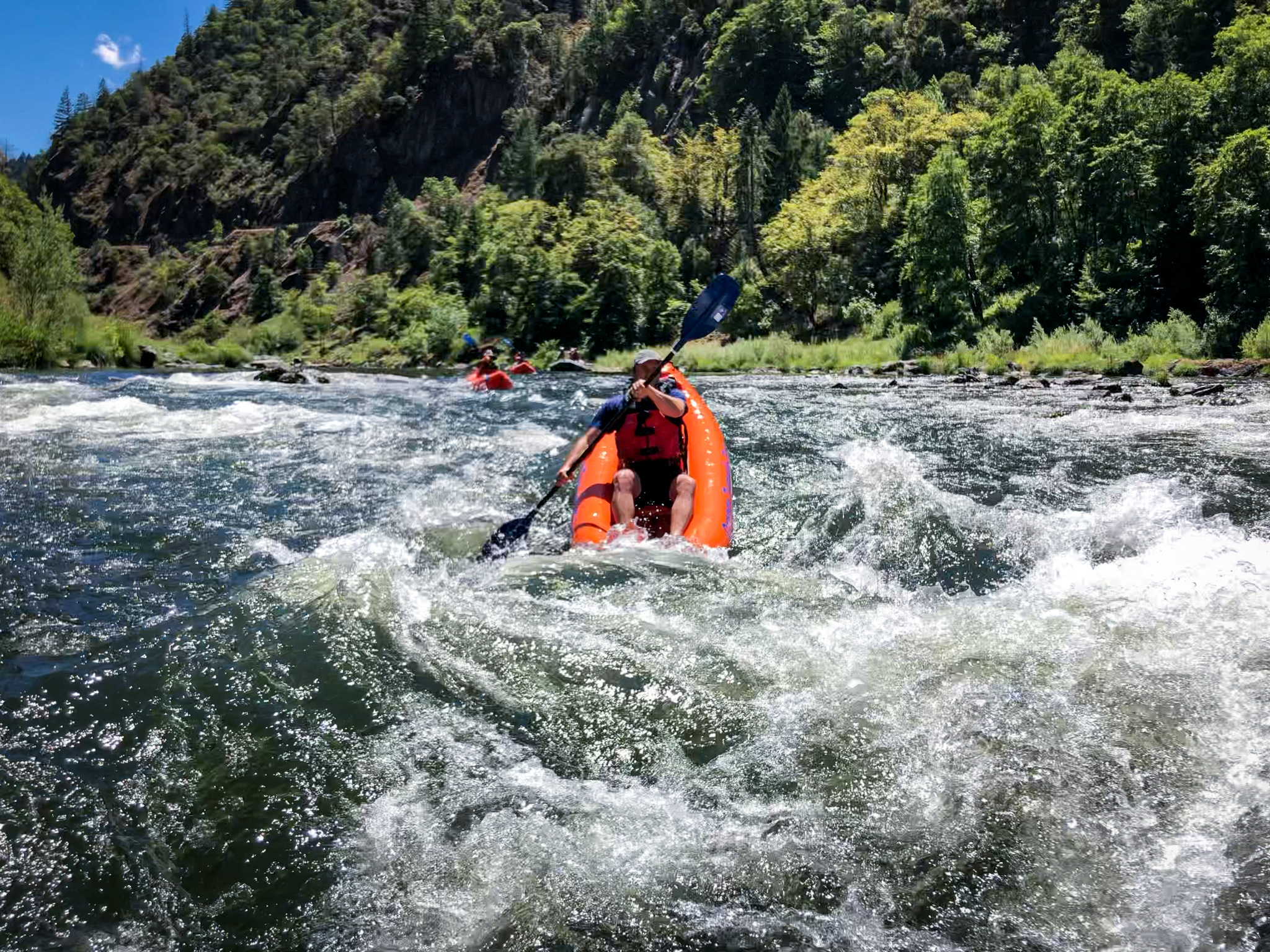 Kayaker in the rapids on the Rogue River in Southern Oregon 