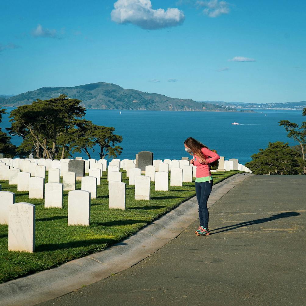 Person walking through San Francisco National Cemetery in the Presidio 