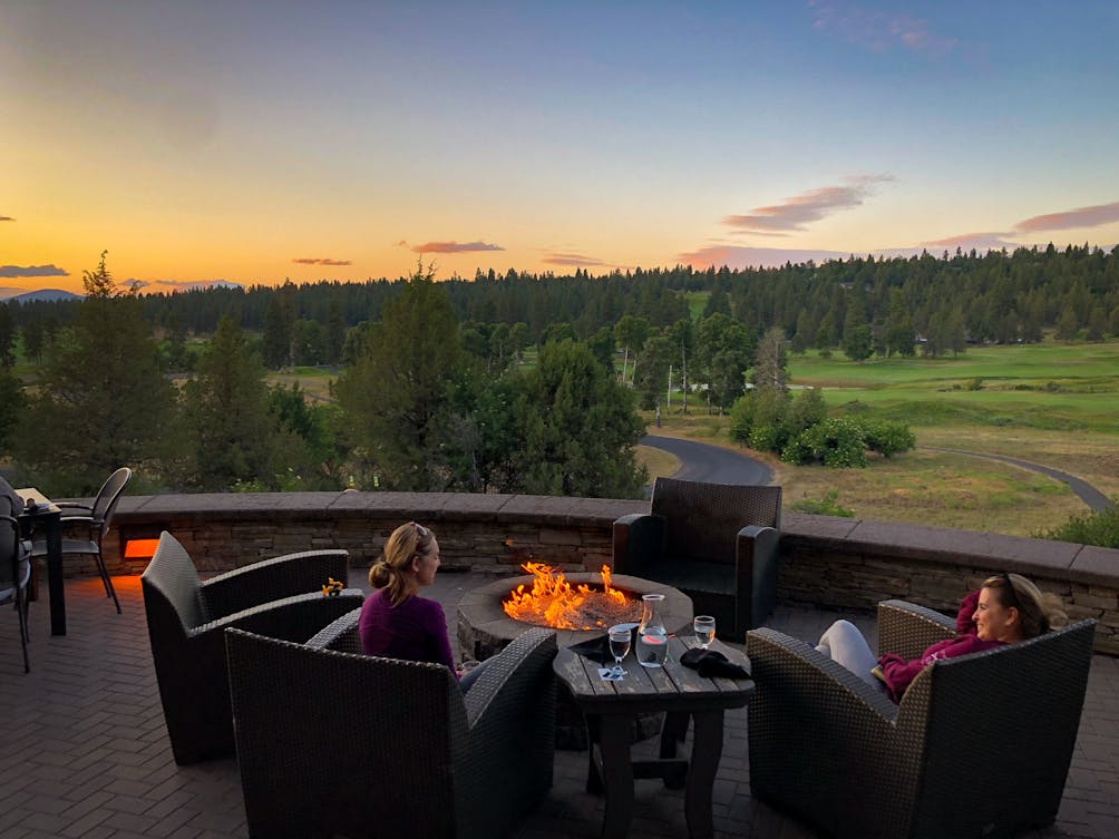 Running Y Ranch Resort people sitting around an outdoor firepit