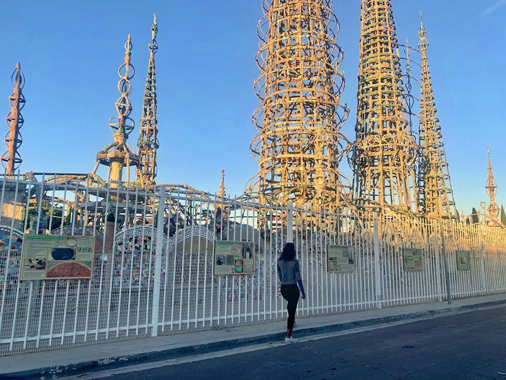 Woman looking at the Watts Towers in LA County 