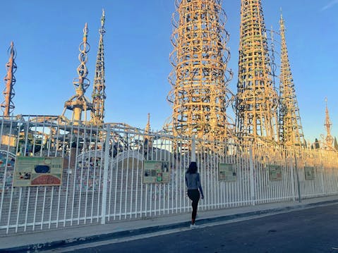 Woman looking at the Watts Towers in LA County 