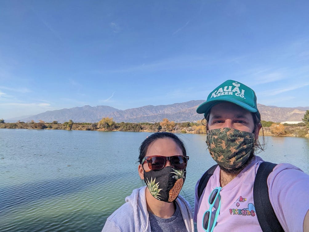 Young couple taking a selfie in front of the lake at Santa Fe Dam Recreation Area