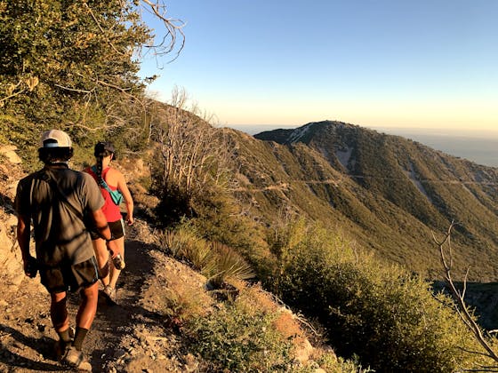 Two hikers on the ridge hiking to San Gabriel Peak in Southern California