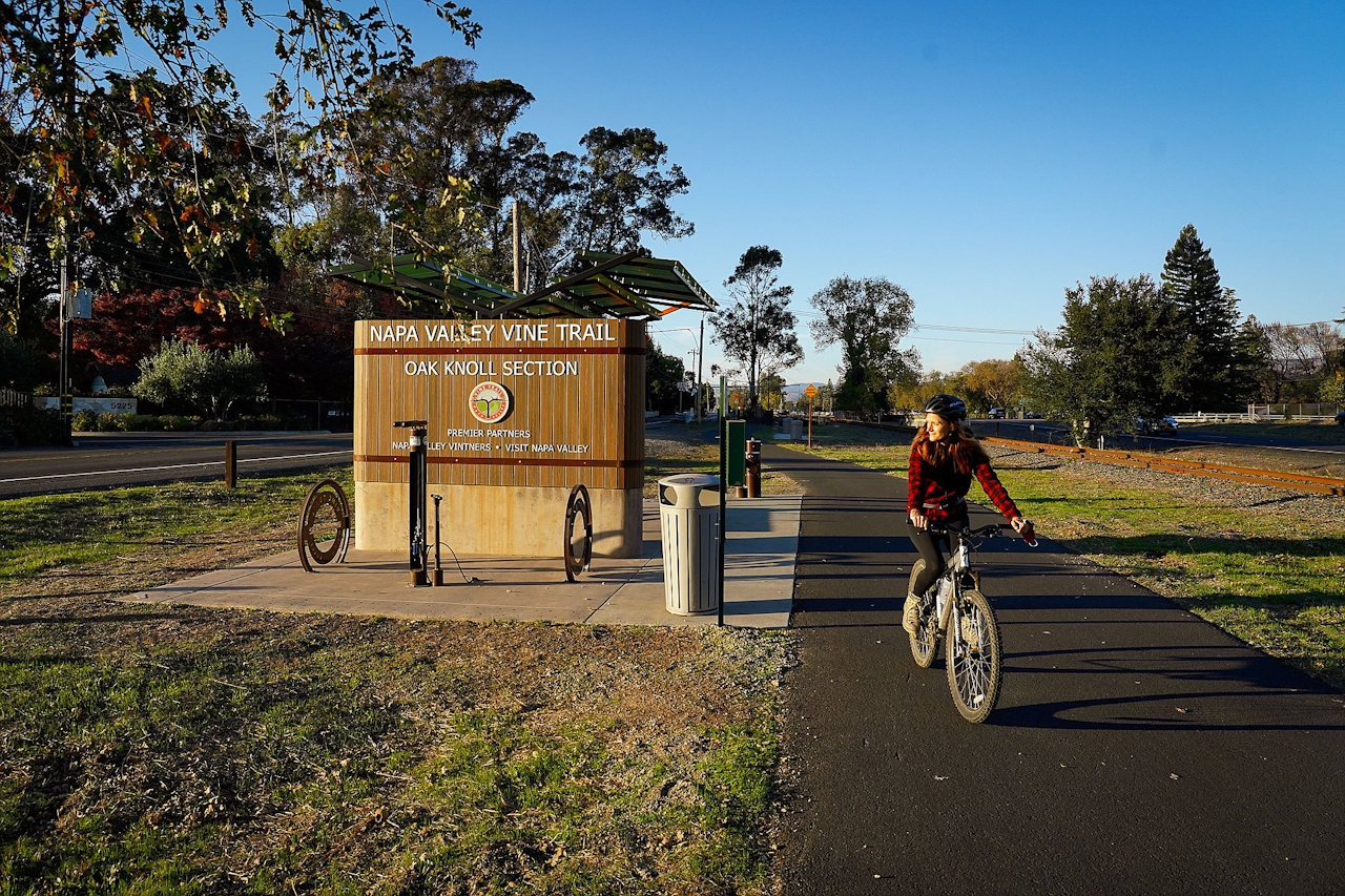 Woman biking on the Vine Trail in Napa Valley 