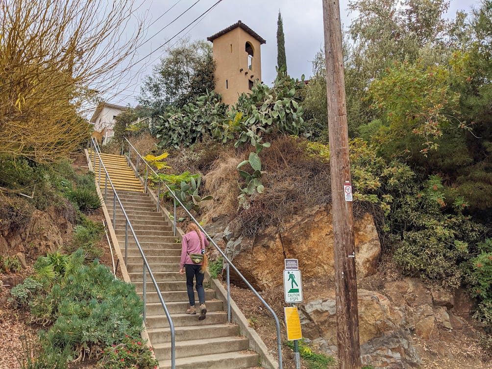 Woman walking up stairs in La Mesa San Diego 