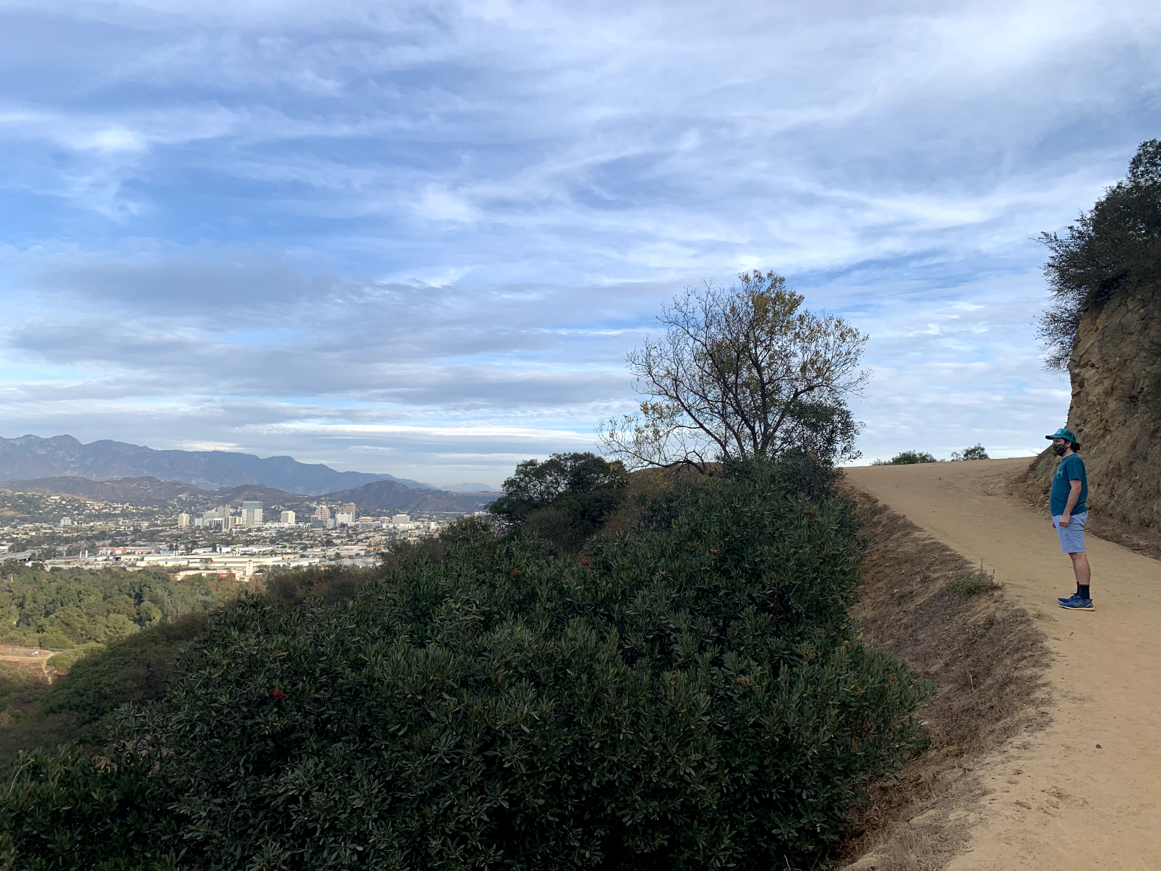 Man on hiking trail to Amir's Garden in Griffith Park Los Angeles 