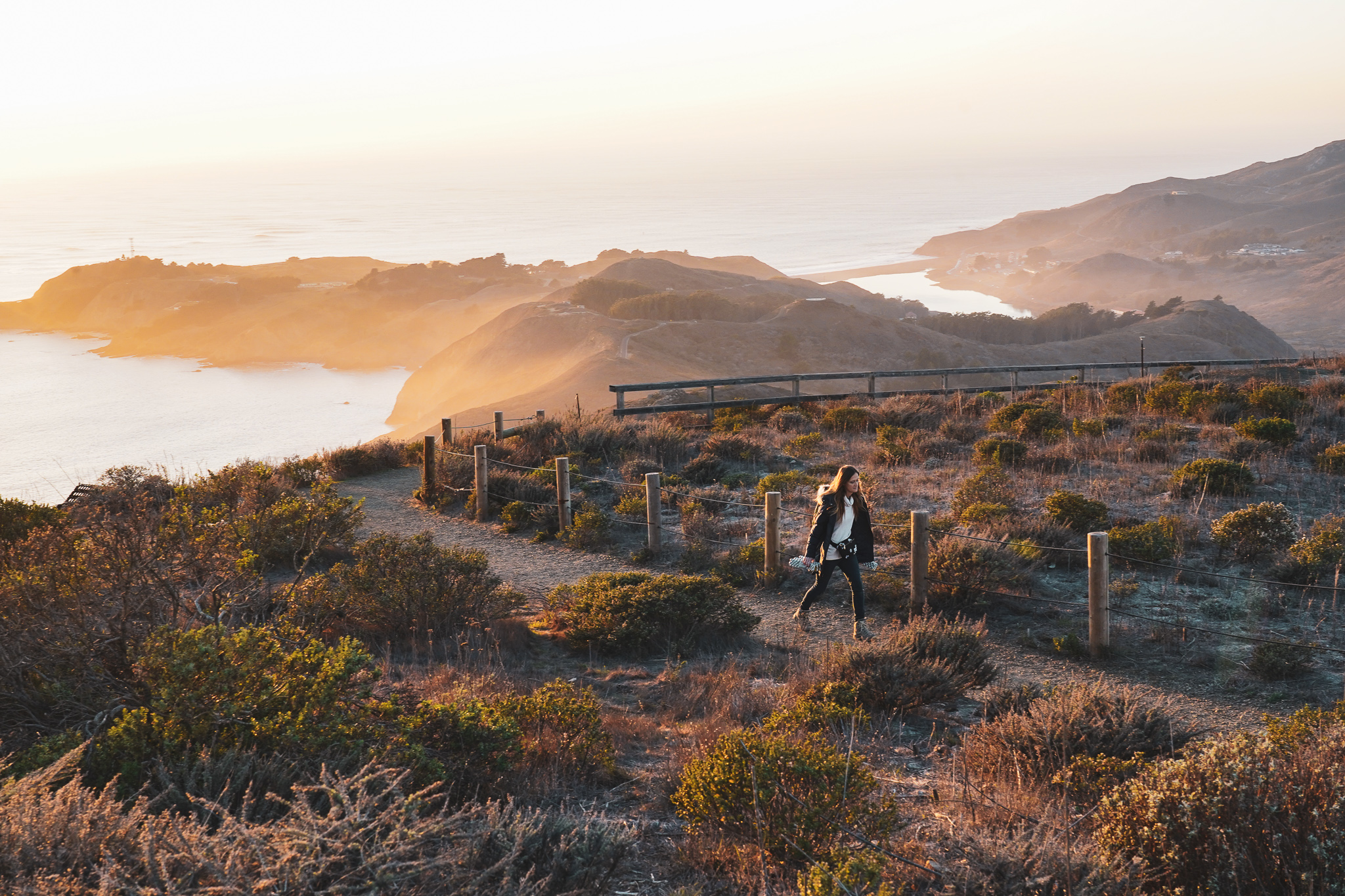Woman hiking Hawk Hill in the Marin Headlands at Sunset