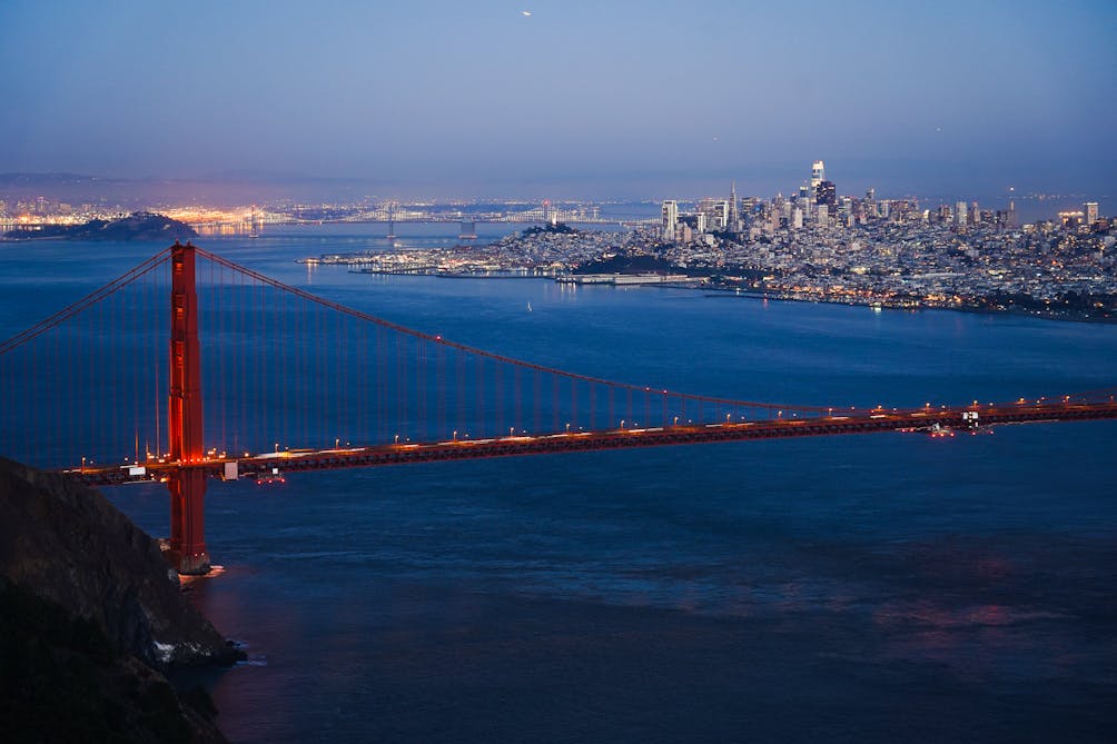 The Golden Gate Bridge and San Francisco sparkling at sunset