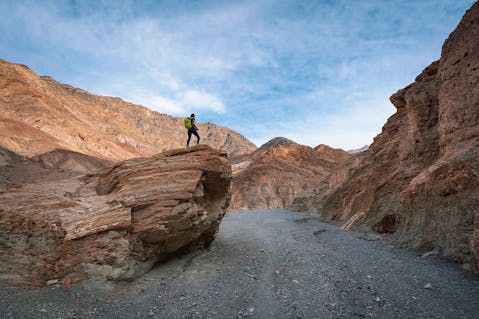 Woman hiking up to views from Desolation Canyon in Death Valley National Park 
