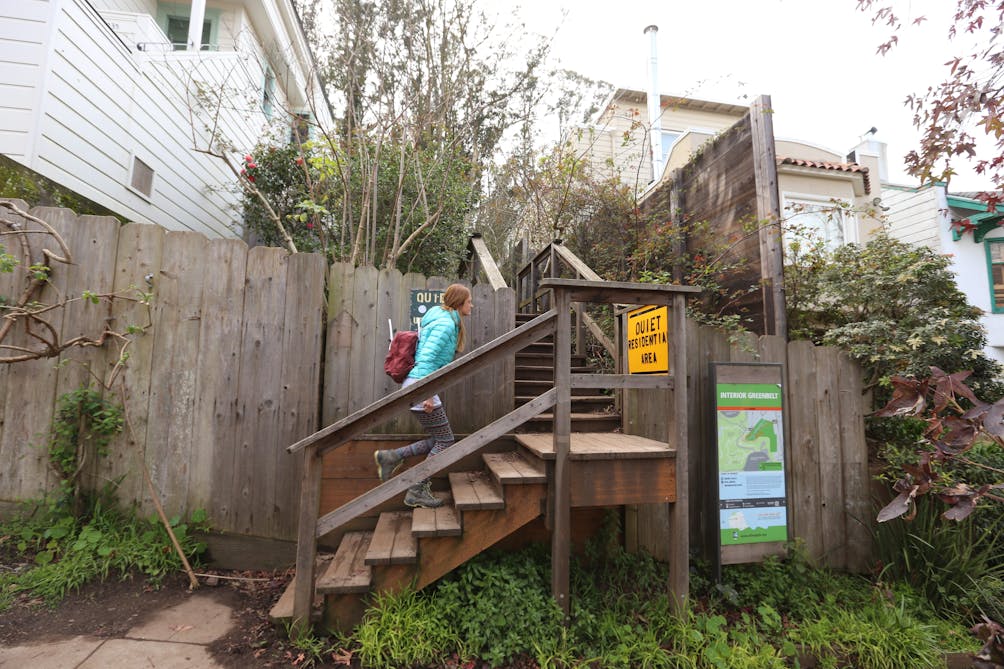 Hiker going up stairs to enter Mount Sutro in San Francisco