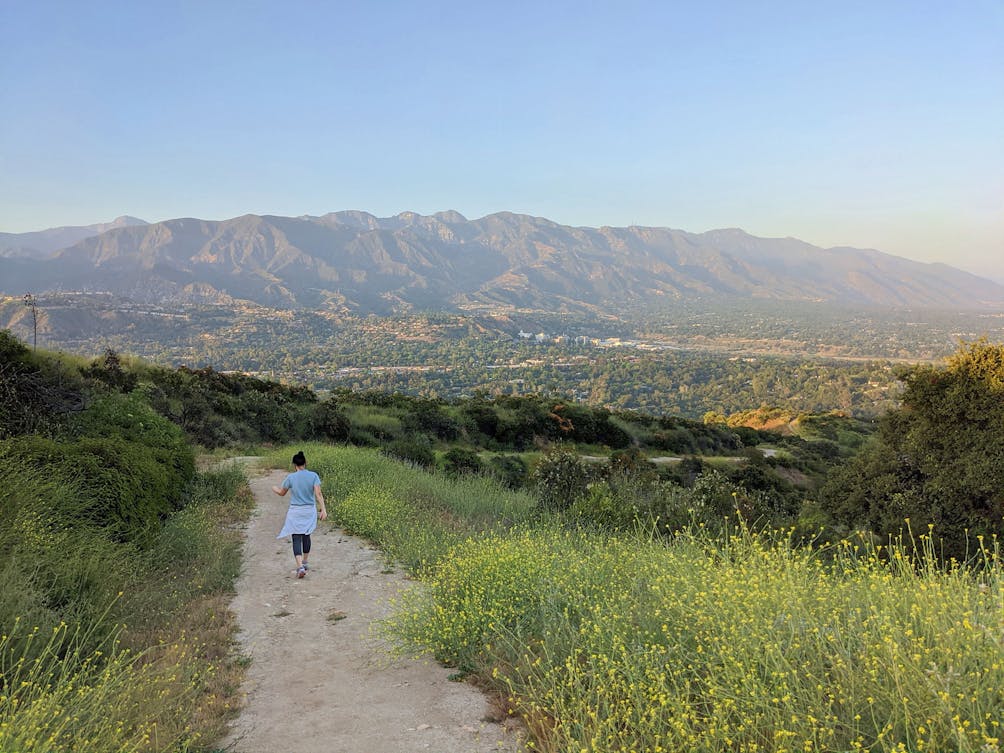 Hiker on the trail at Cherry Creek Canyon Park in LA. 