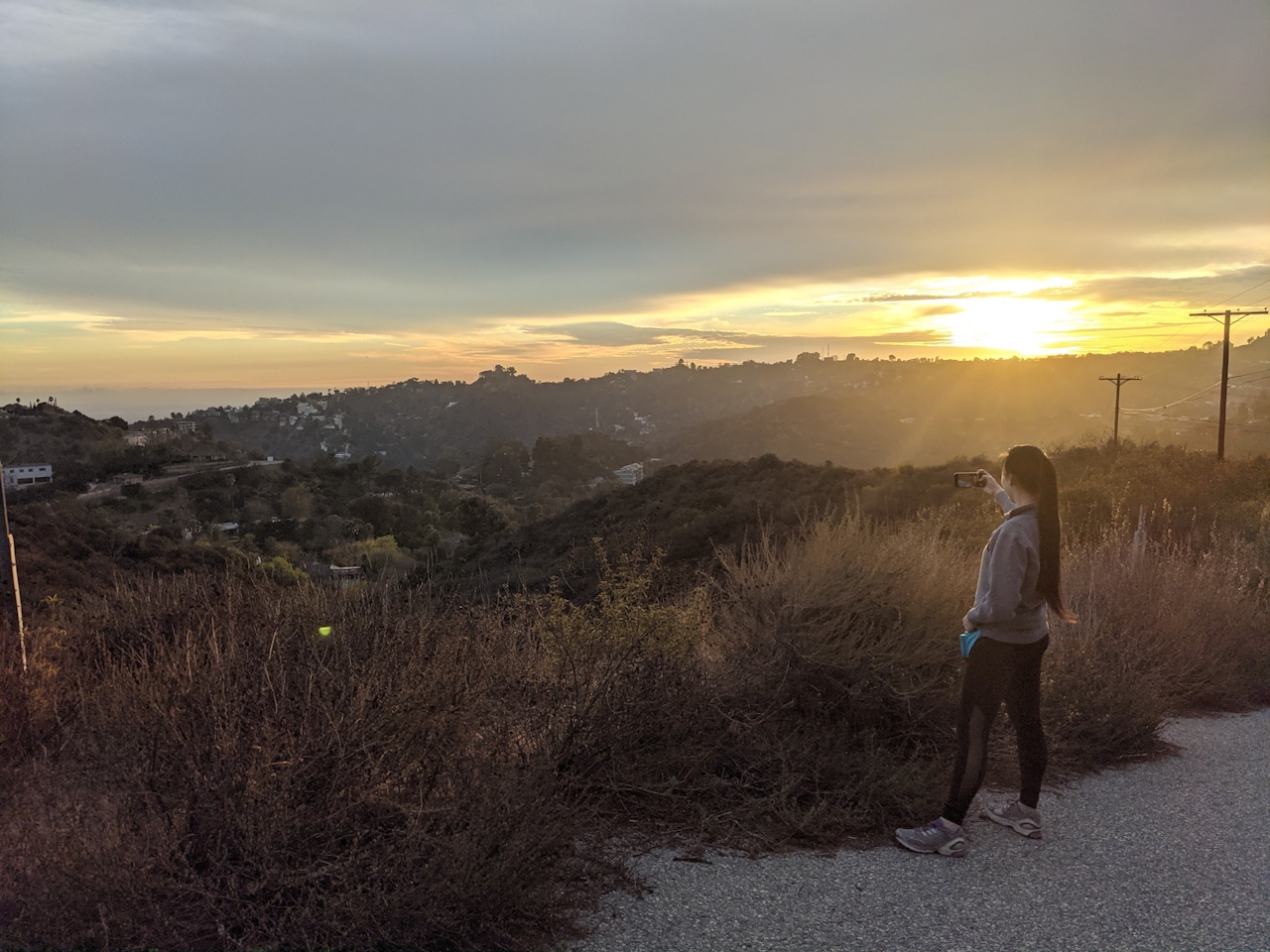 Woman taking in the view of Los Angeles at Briar Summit Preserve