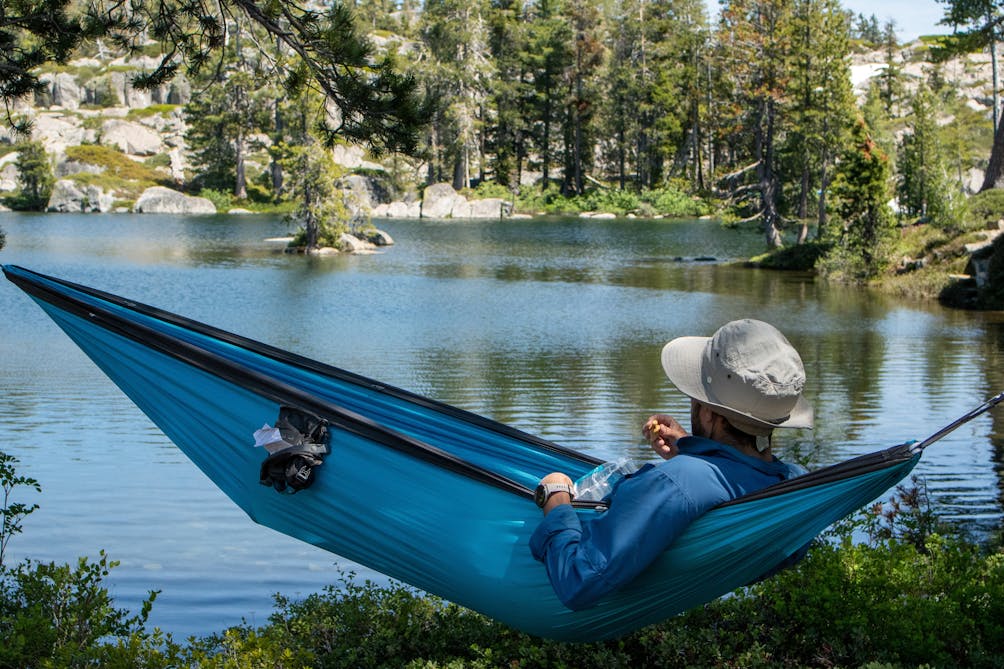 Person sitting in a hammock at Loch Leven Lakes in Tahoe National Forest 